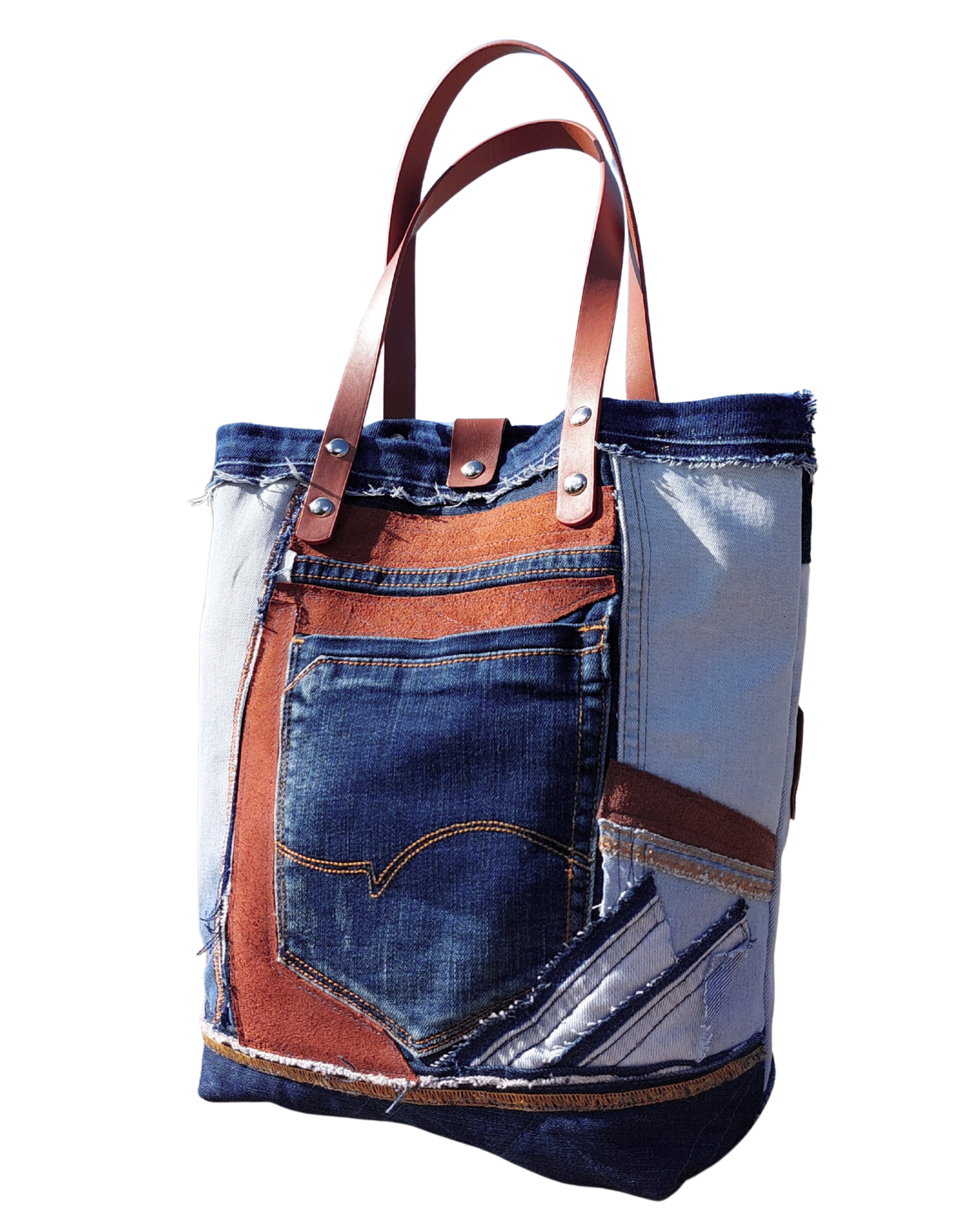 Tote bag made from recycled denim and leather on a white background