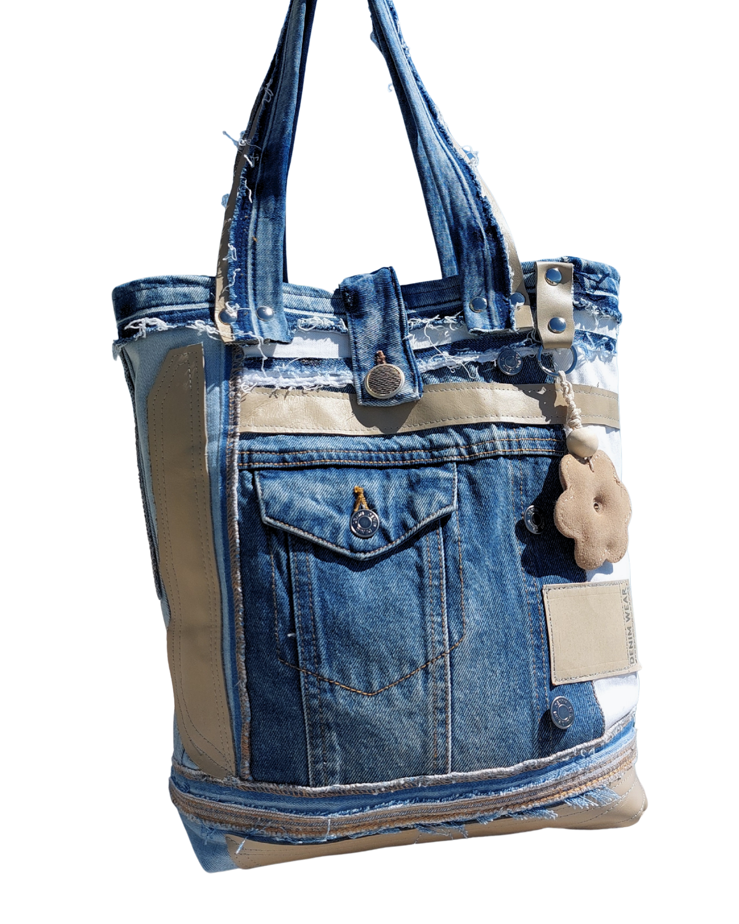 Denim tote bag with beige accents on a white background